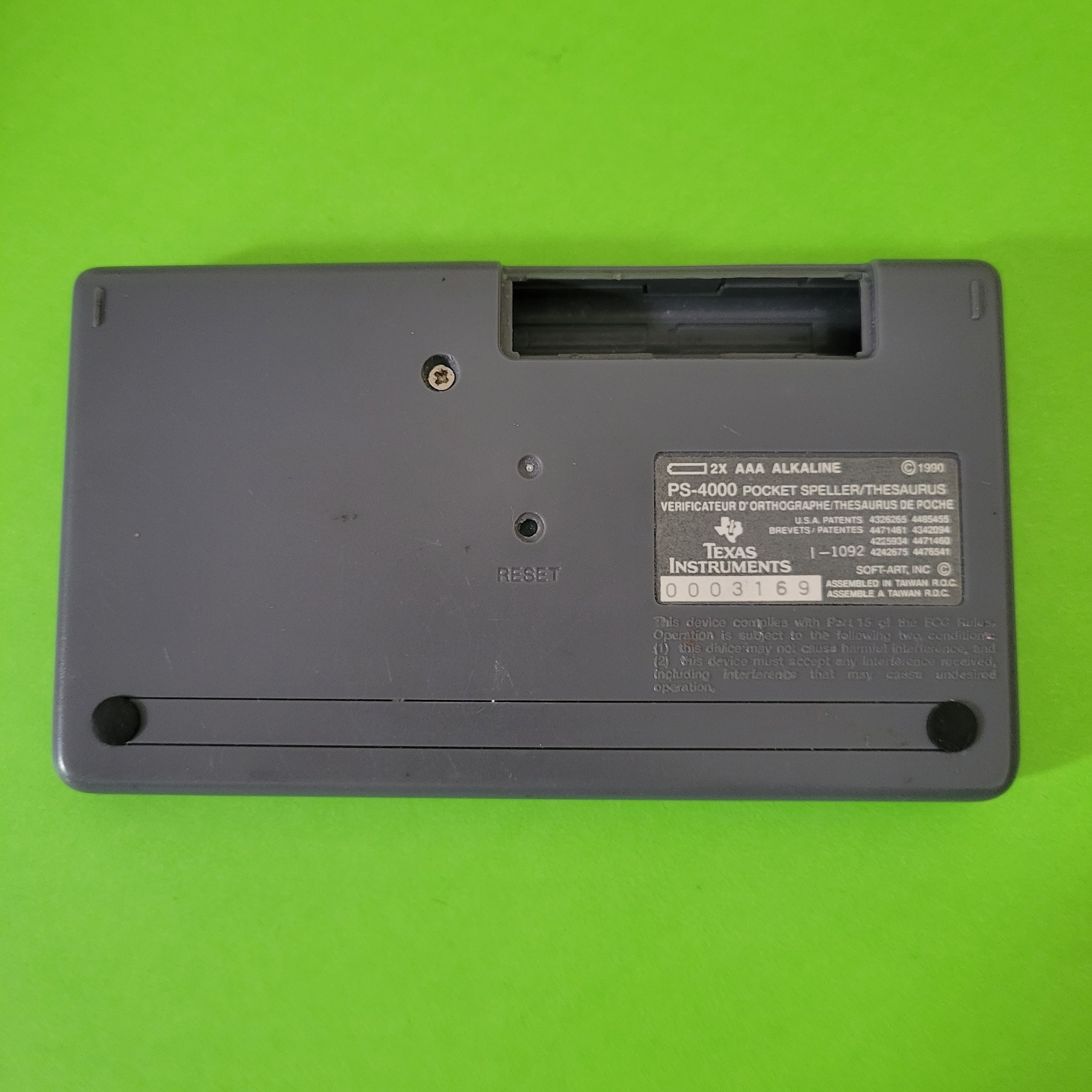 An image of the back of a Texas Instruments Pocket Thesaurus Speller